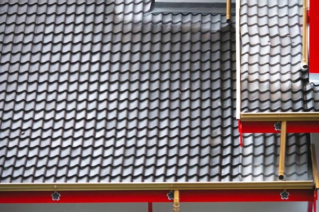 A tin roof on a home. Here are some common roofing solutions for homeowners.