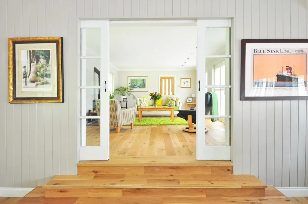 Bright room with plants and bamboo flooring, an example of Sustainable home design