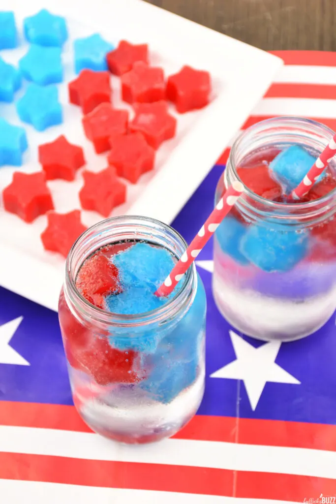 Overhead shot of glasses with red and blue Jell-O ice cubes