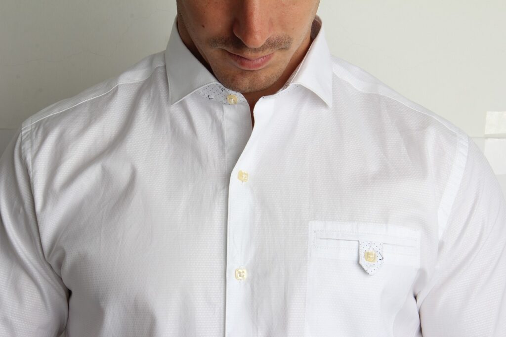 A man wearing a white button up shirt