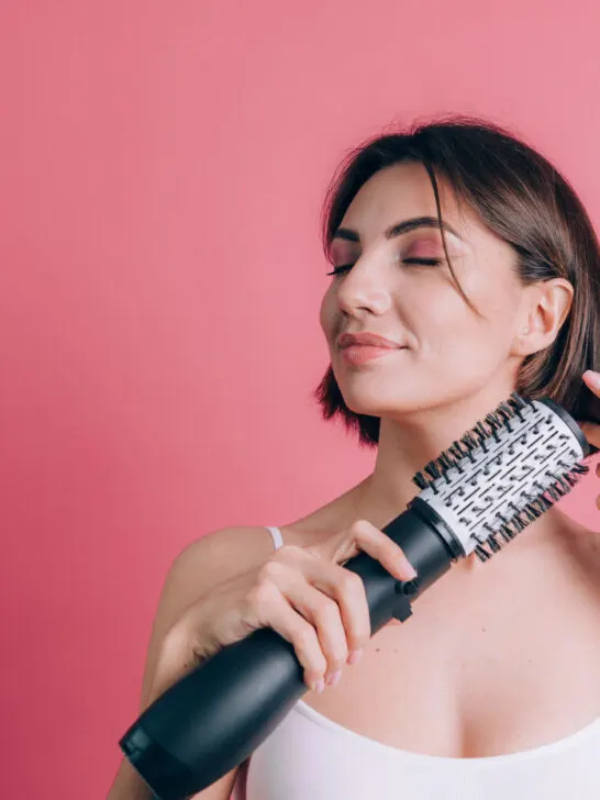 Three women with lovely long straight hair made beautiful by using a hair straightening brush