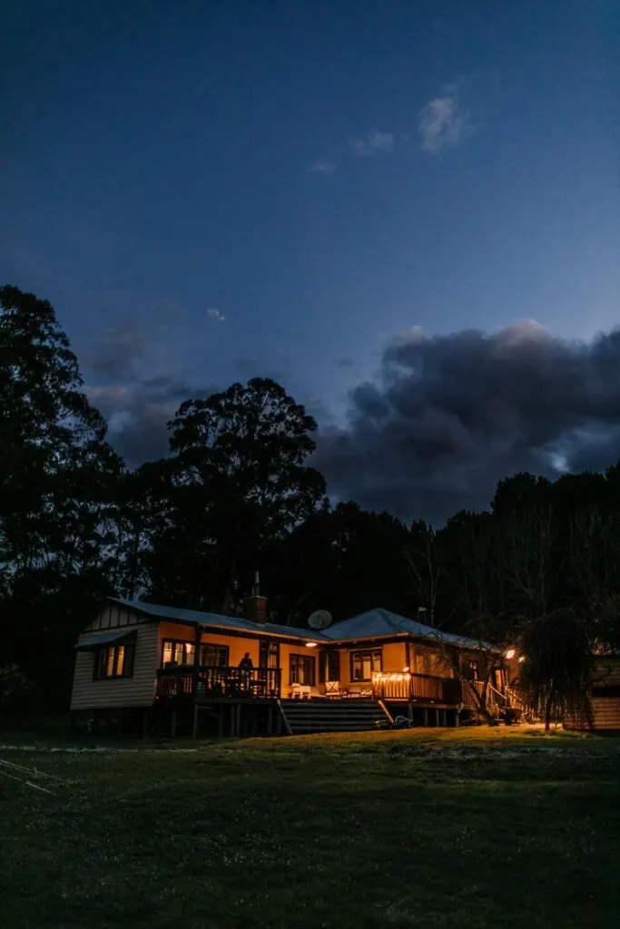 a house seen at night from the outside with lights on. Picking a good plan is a key part of finding the best energy plan for maximum savings