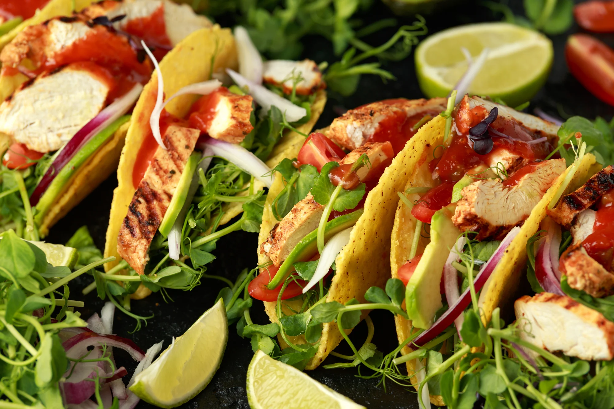 Grilled chicken breast and pea shoots salad tacos with sweet chilli tomato dip sauce.