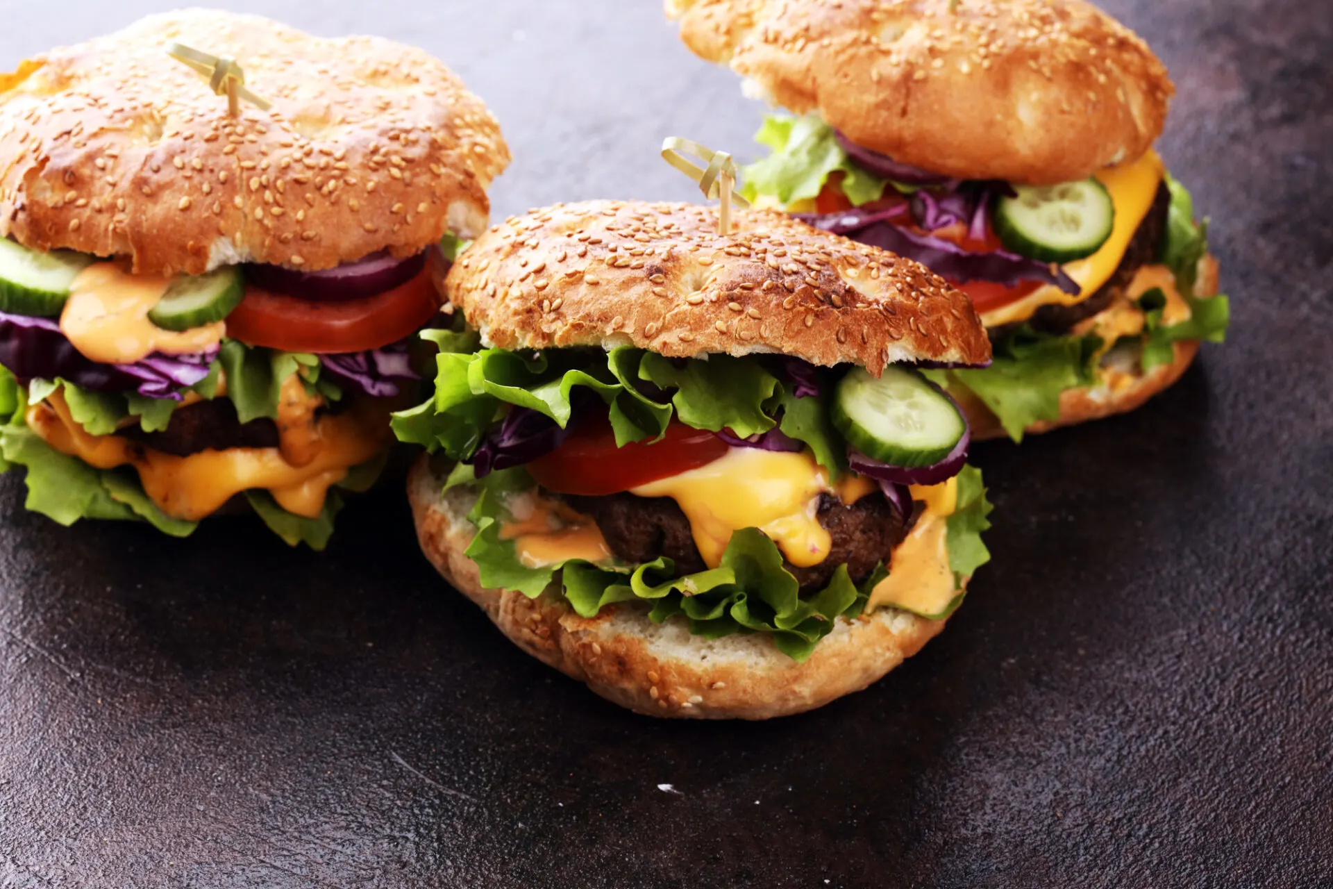 Tasty fresh meat burgers with salad and cheese. Homemade angus burger with salad.