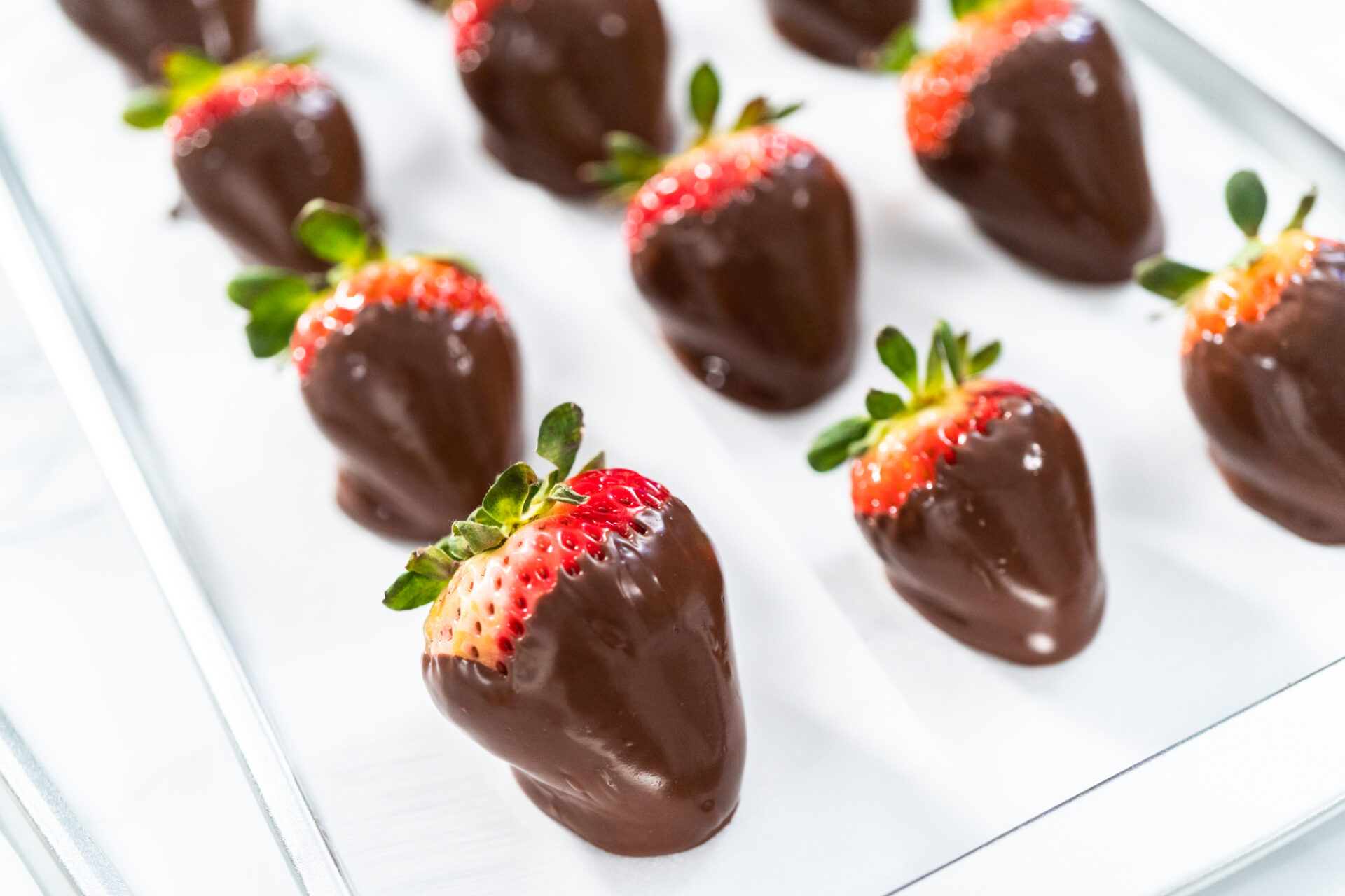 Making white and dark chocolate dipped strawberries.