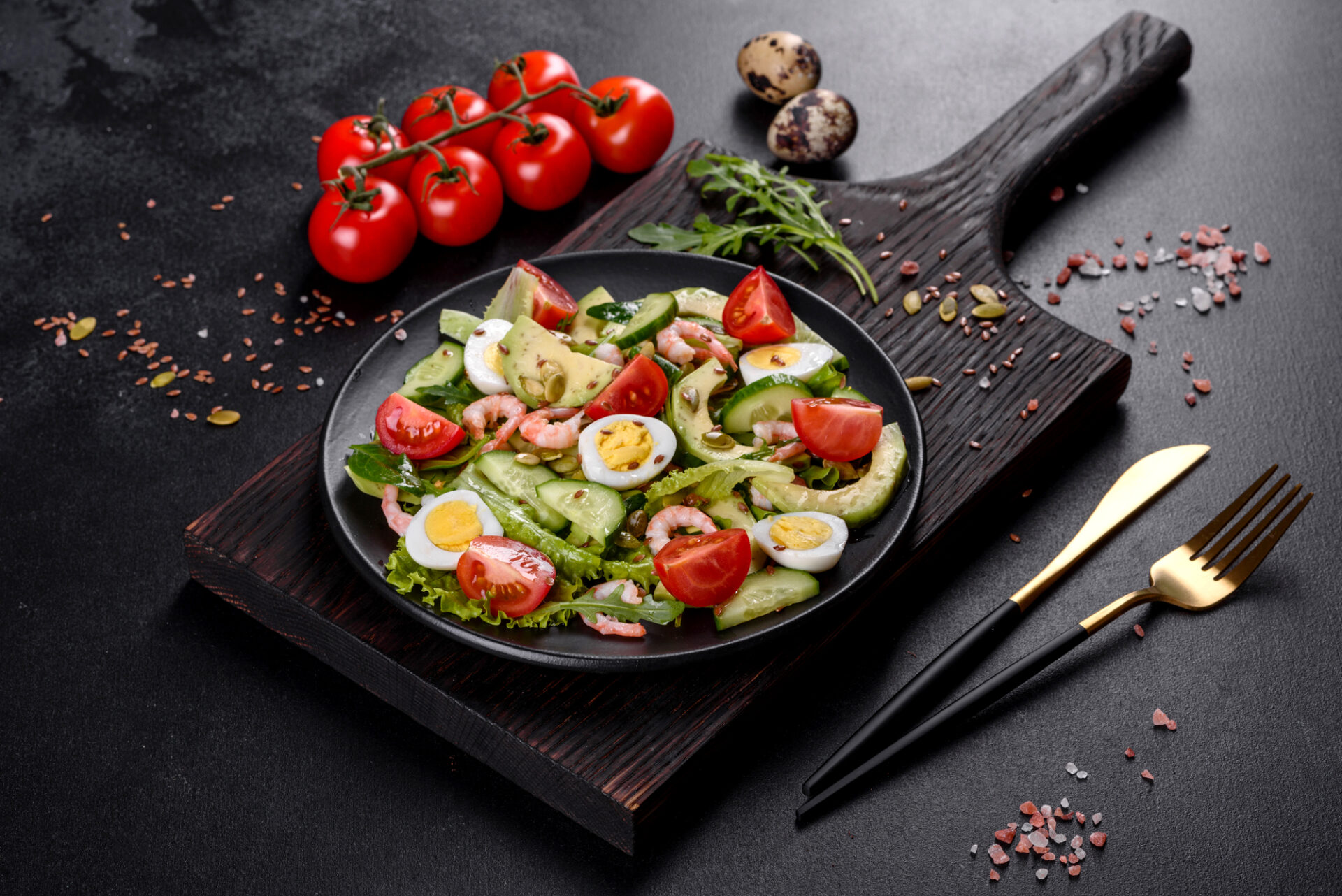 Salad with shrimp, avocado, cucumber, pumpkin seeds and flax seeds with olive oil. Healthy Food Dish
