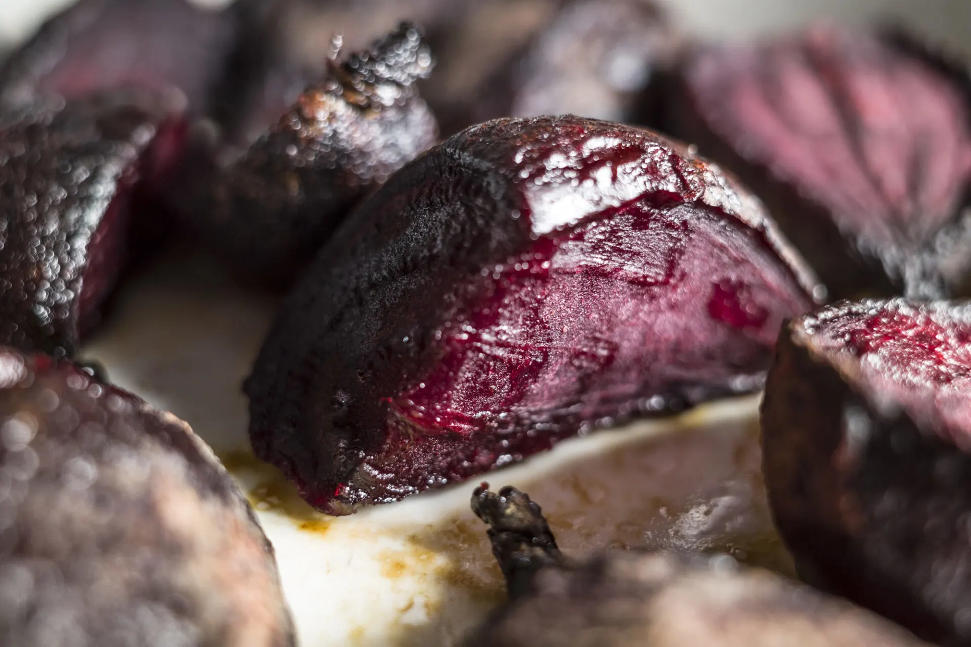 Roasted red beets on a baking tray
