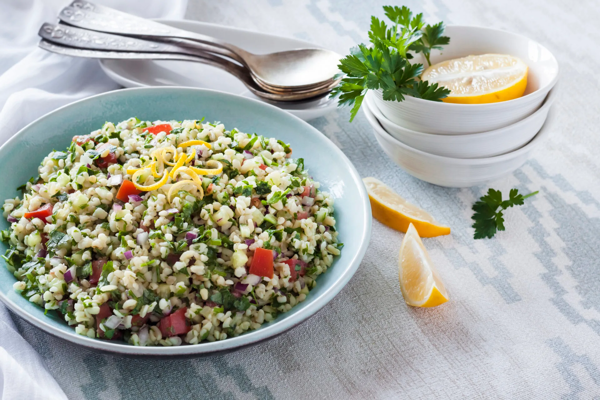 Tabbouleh salad. Traditional middle eastern or arab vegetarian salad with bulgur, parsley, mint and tomato.