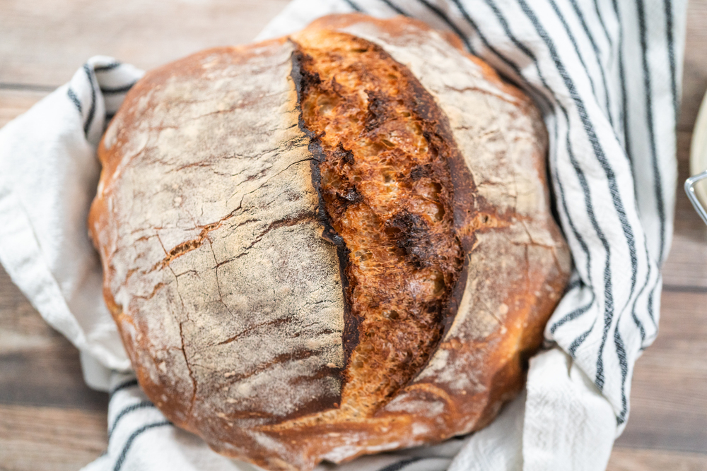 Freshly baked sourdough rye loaf of bread.