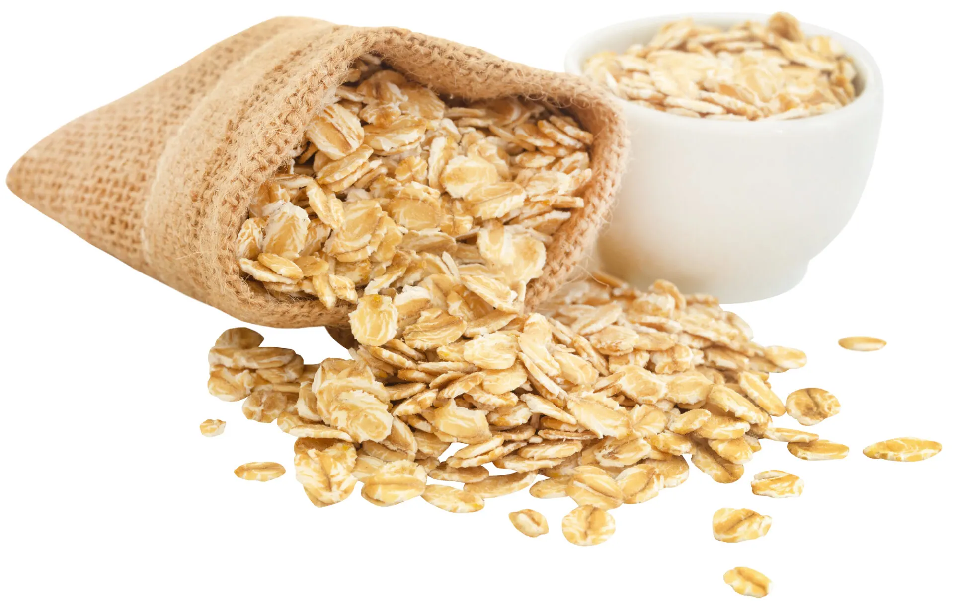 Whole oats in jute sack and a bowl