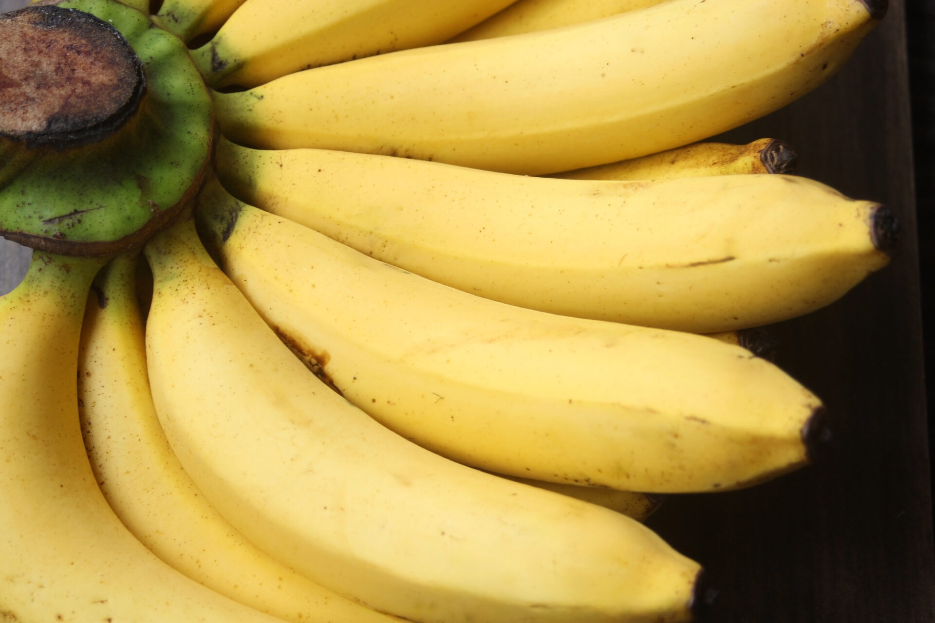 Banana fruit with wooden table on blurred background