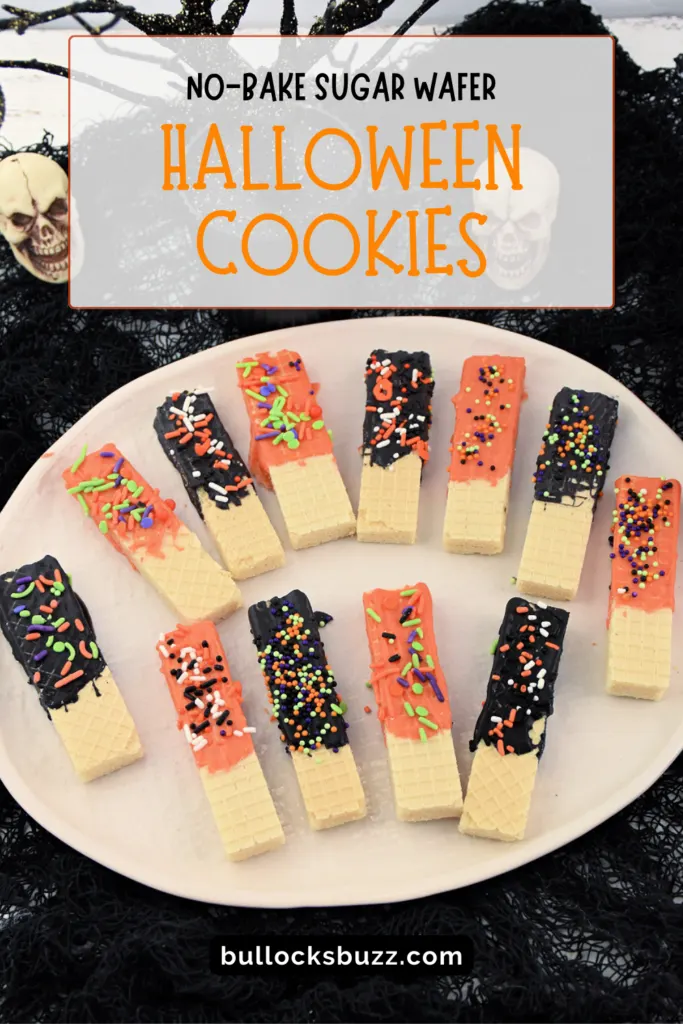 overhead view of orange and black chocolate-dipped cookies for Halloween
