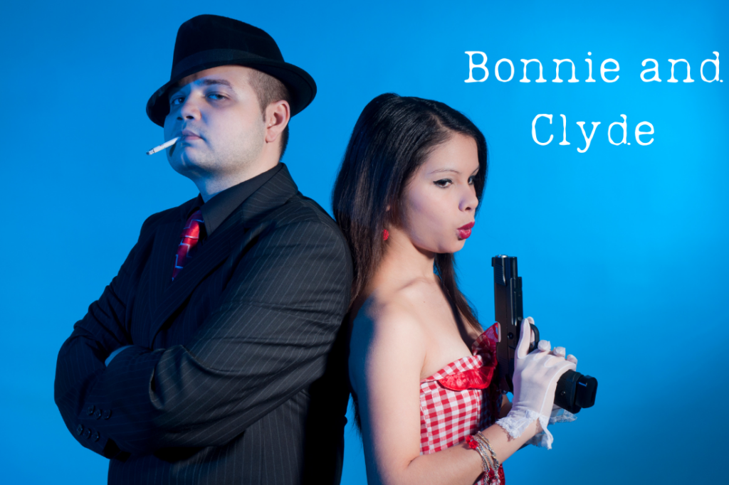 A man and woman dressed as Bonnie and Clyde