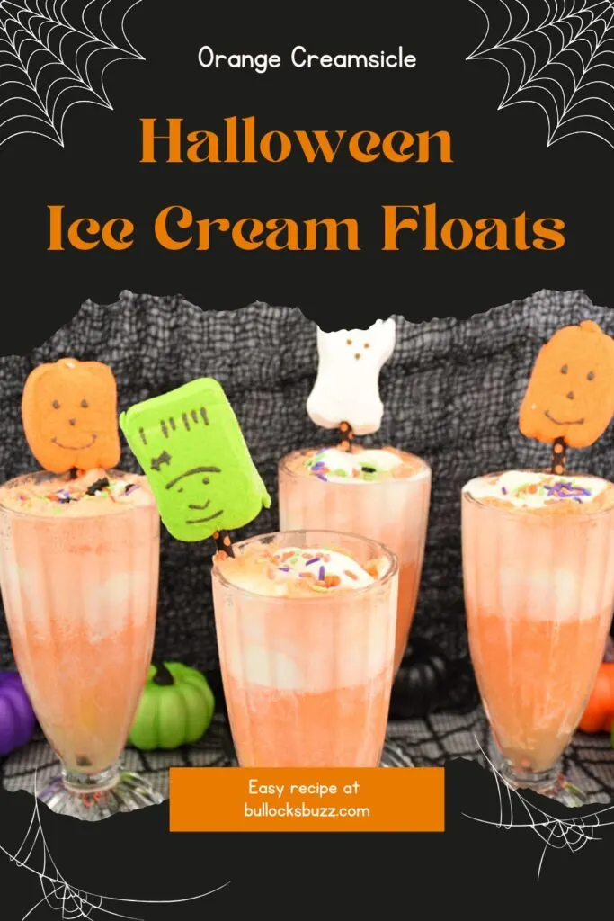 Close up of finished orange soda Halloween ice cream floats with black and orange straws topped with Halloween marshmallow Peeps including Frankenstein, ghosts and jack o lanterns