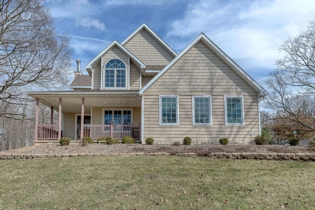A picture of the front of a house with a pest-free yard surrounding it