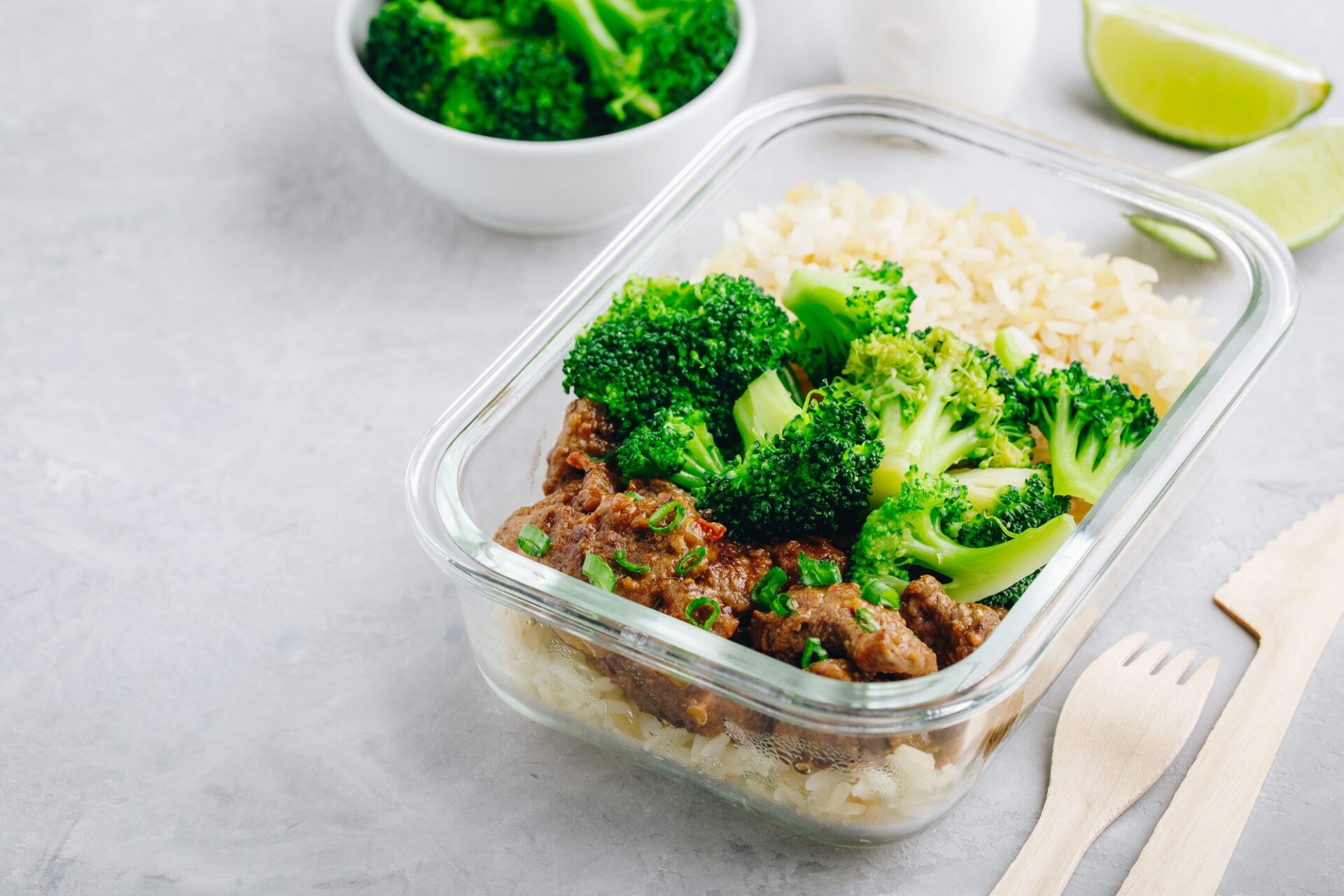 Beef Broccoli Stir Fry Meal Prep lunch box container on gray stone background