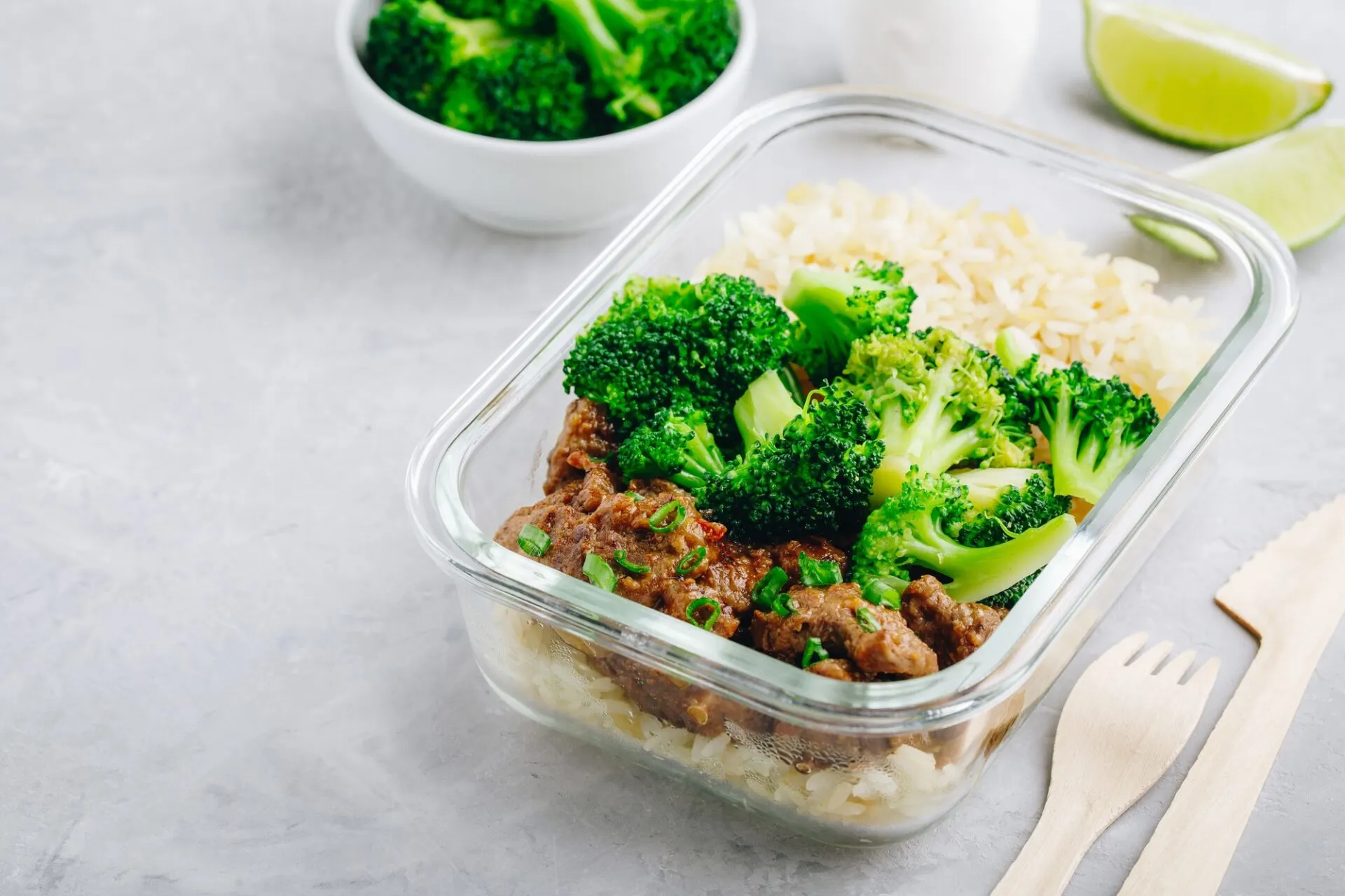 Beef Broccoli Stir Fry Meal Prep lunch box container on gray stone background