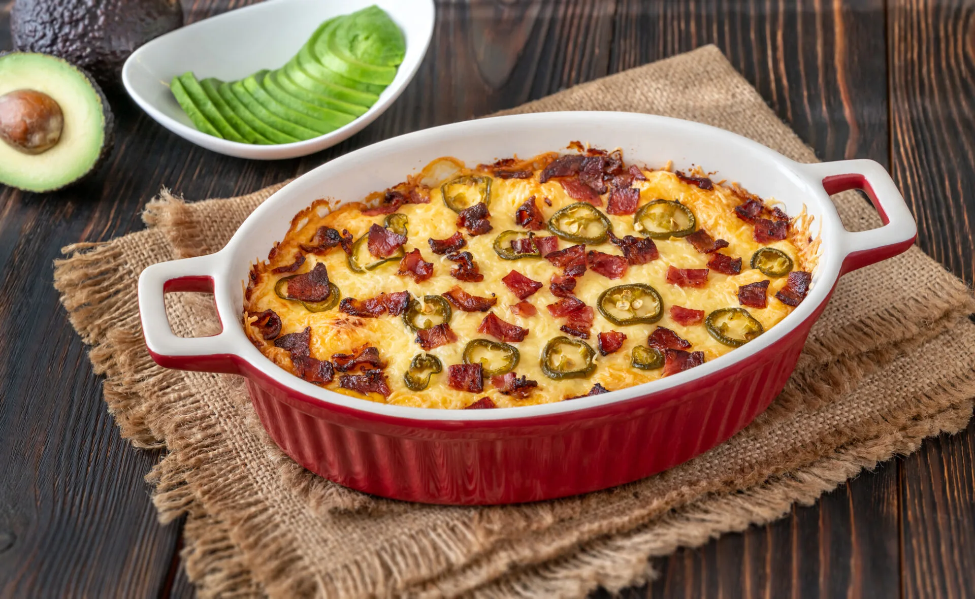 Dish of Jalapeno popper dip with cheese and bacon
