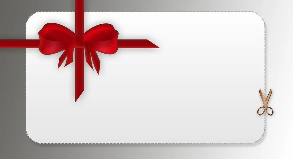 A graphic of a white gift card with a red bow tie on it.