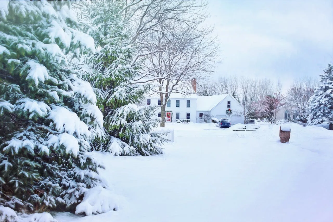 A house in the snow. Use these practical tips to keep your house warm this winter.