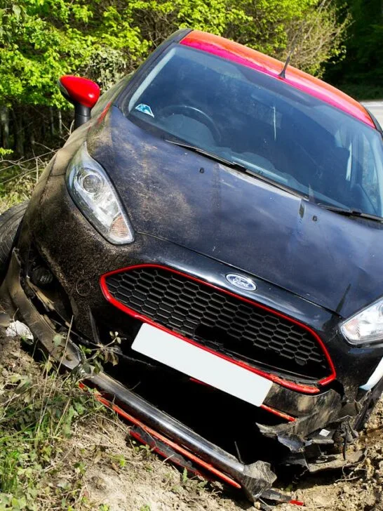 Car sitting in the ditch after having car accidents and injuries