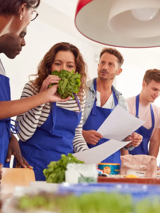Male and female students in a cooking class