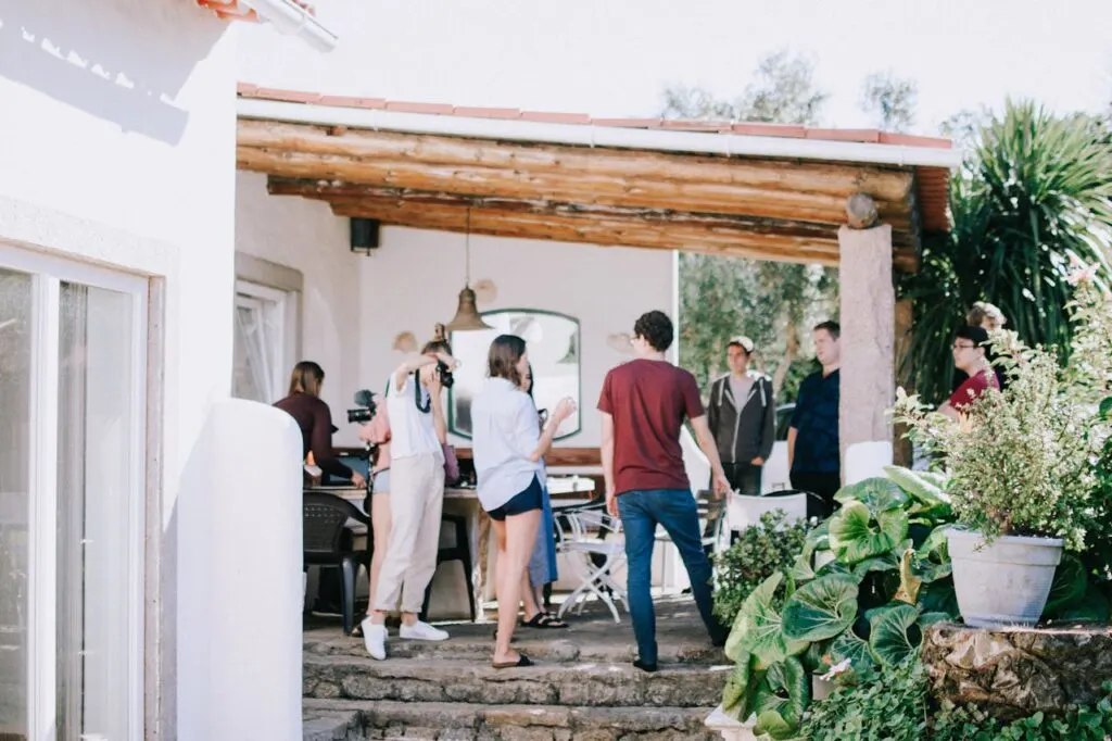 A group of people under a back awning