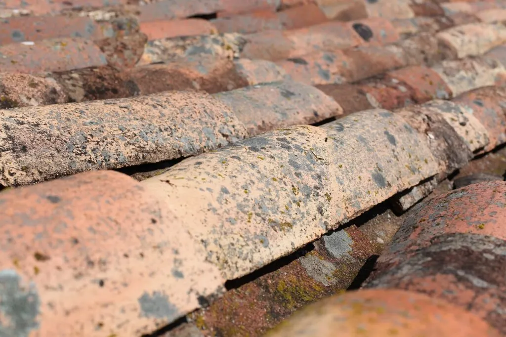 Wear to a tile roof showing why its important to pay attention when the time comes for repairing your roof