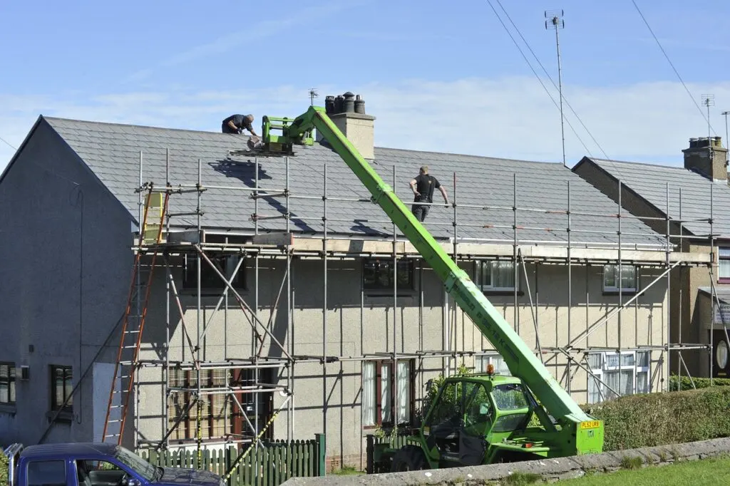 Scaffolding around a house having its roof repaired