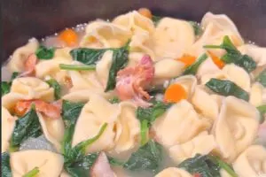 close up of finished Cheese Tortellini Soup with Bacon and Spinach in bowl