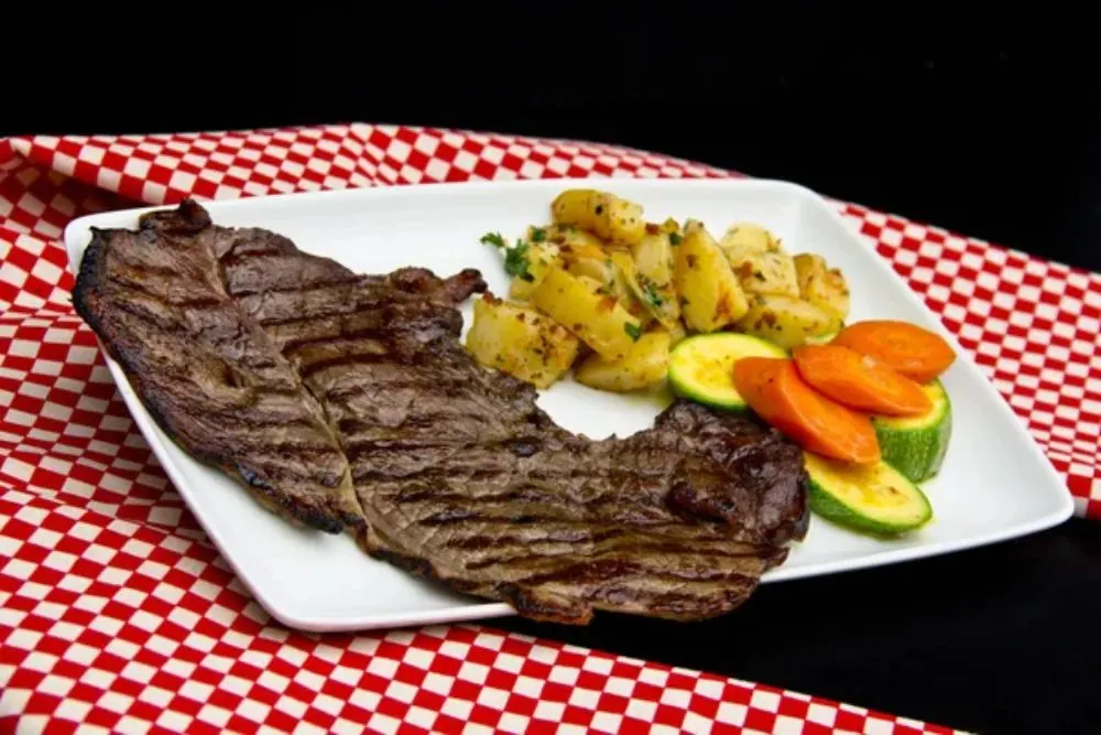 Restaurant beef steak with vegetables and roasted potatoes