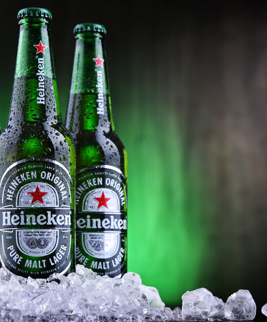 POZNAN, POL - AUG 22, 2019: Bottles of Heineken Lager Beer, the flagship product of Heineken International which owns over 125 breweries in more than 70 countries
