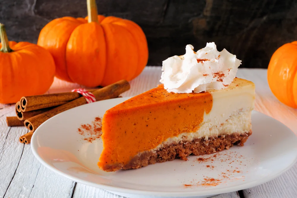 alt="Slice Pumpkin Cheesecake Whipped Cream Side View Table Scene Dark — Stock Photo, Image"