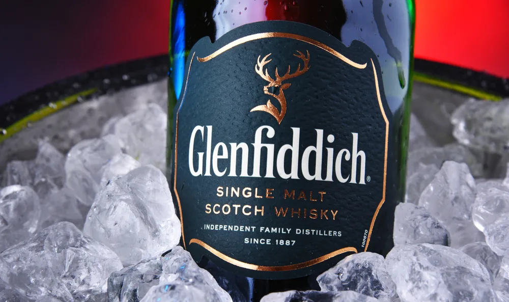 POZNAN, POL - OCT 31, 2019: Bottle of Glenfiddich, the world's best-selling single-malt whisky, owned and produced by William Grant and Sons in Dufftown, Scotland