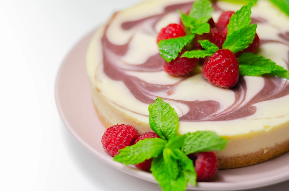 Creamy Vanilla Baked Cheesecake Swirled Raspberry Sauce Biscuit Crumb Base — Stock Photo, Image