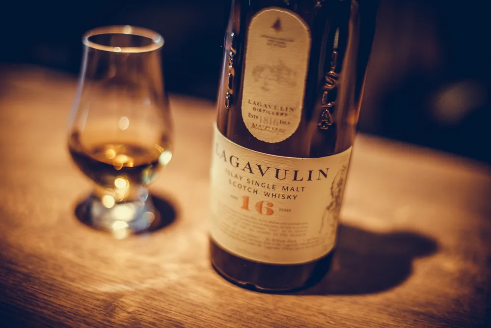 Bucharest Romania - January 27, 2020: Illustrative editorial image of a bottle of Lagavulin single malt scotch whisky is displayed in bar in Bucharest, Romania.