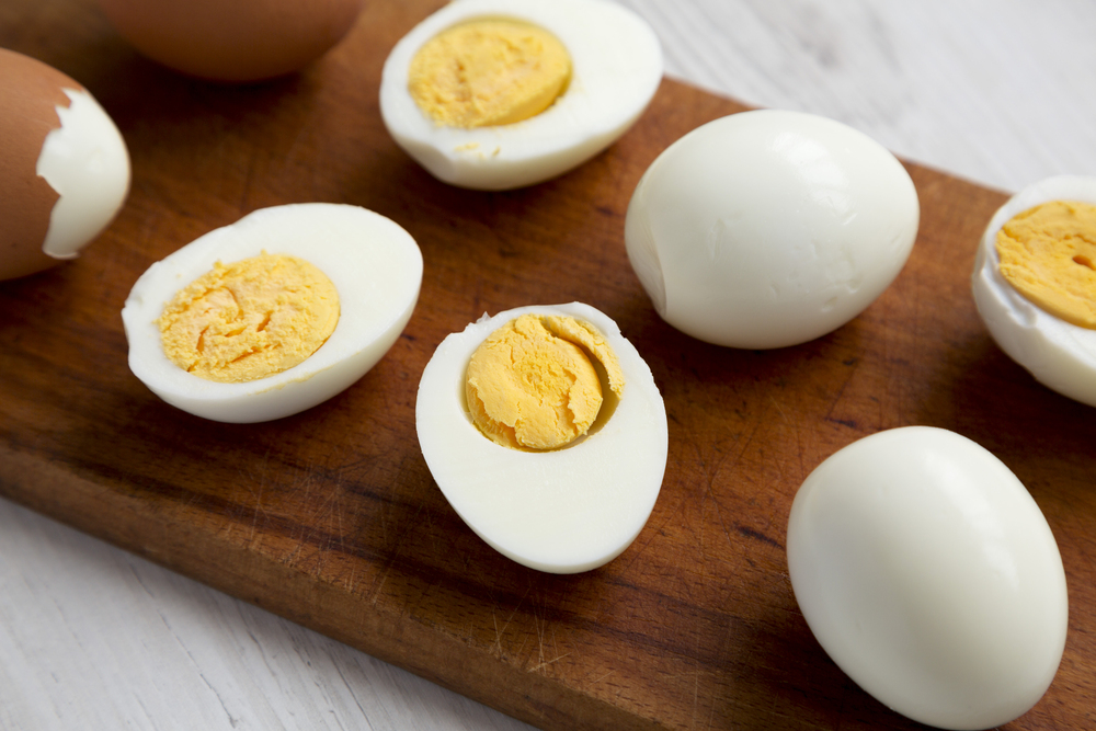 Hard Boiled Eggs on a rustic wooden board
