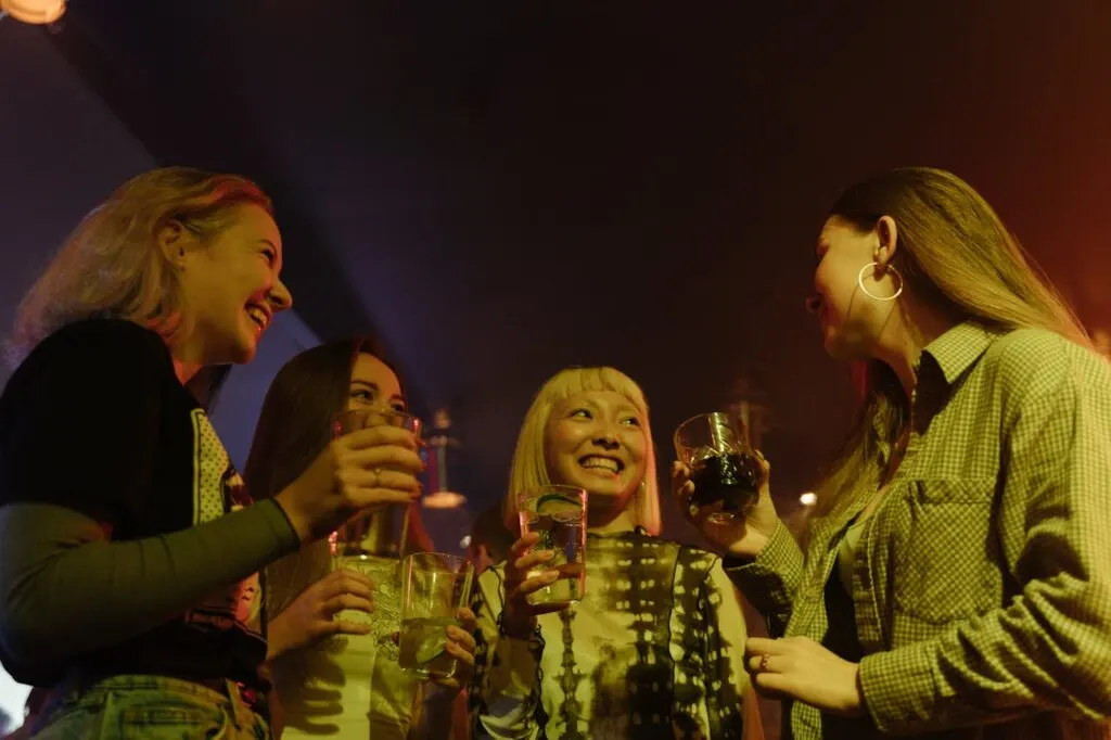 Four friends out together having a drink