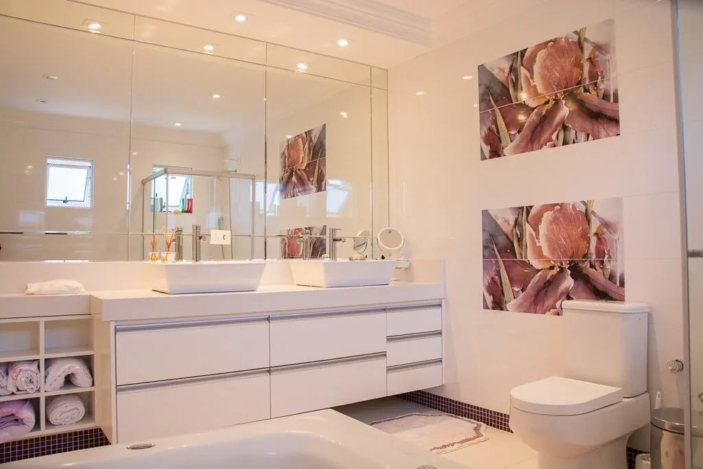 A newly remodeled bathroom like this white one is one of the best remodeling choices to maximize your home's value