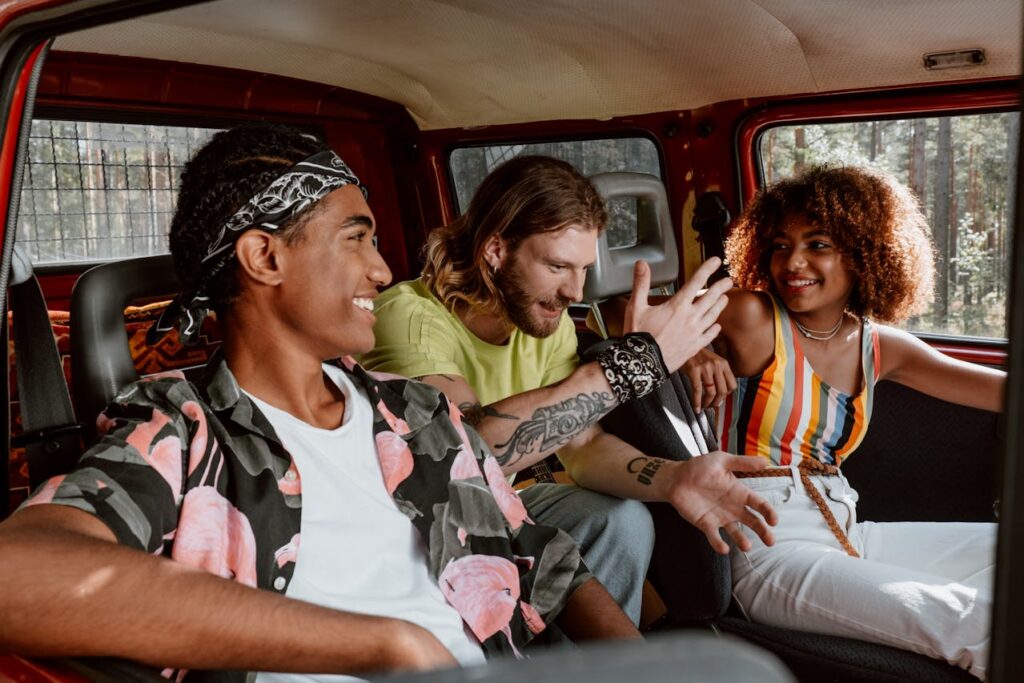 A group of friends talking while ridesharing