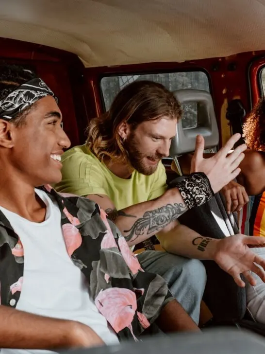 A group of friends talking while ridesharing