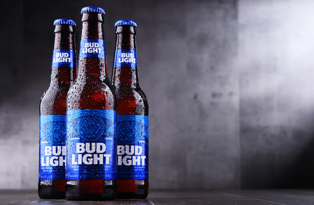 POZNAN, POL - MAY 3, 2018: Bottles of Bud Light beer, an American light beer, produced by Anheuser-Busch, introduced in 1982. — Photo by monticello