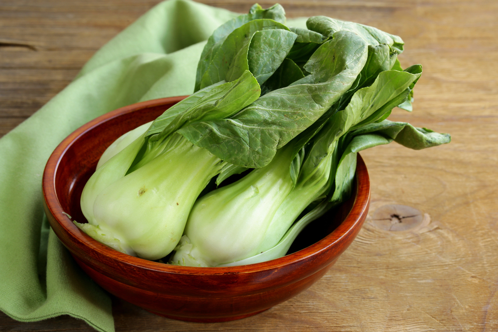 Bok choy (chinese cabbage) on a wooden table — Photo