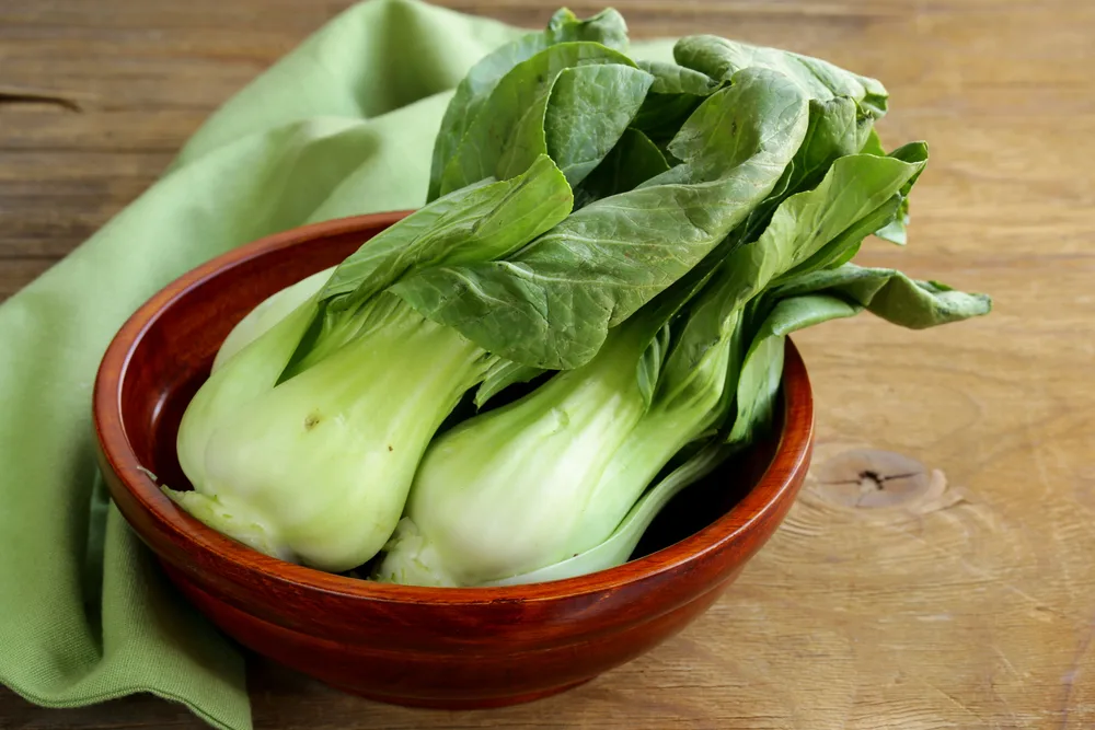 Bok choy (chinese cabbage) on a wooden table — Photo