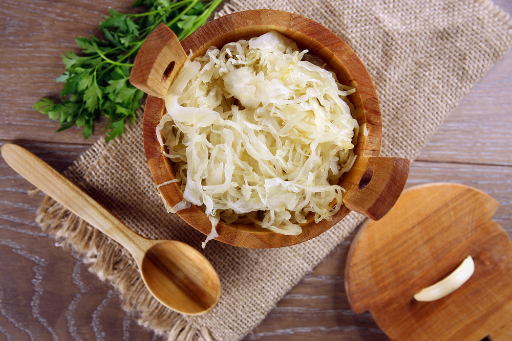 Sauerkraut in a wooden barrel — Photo