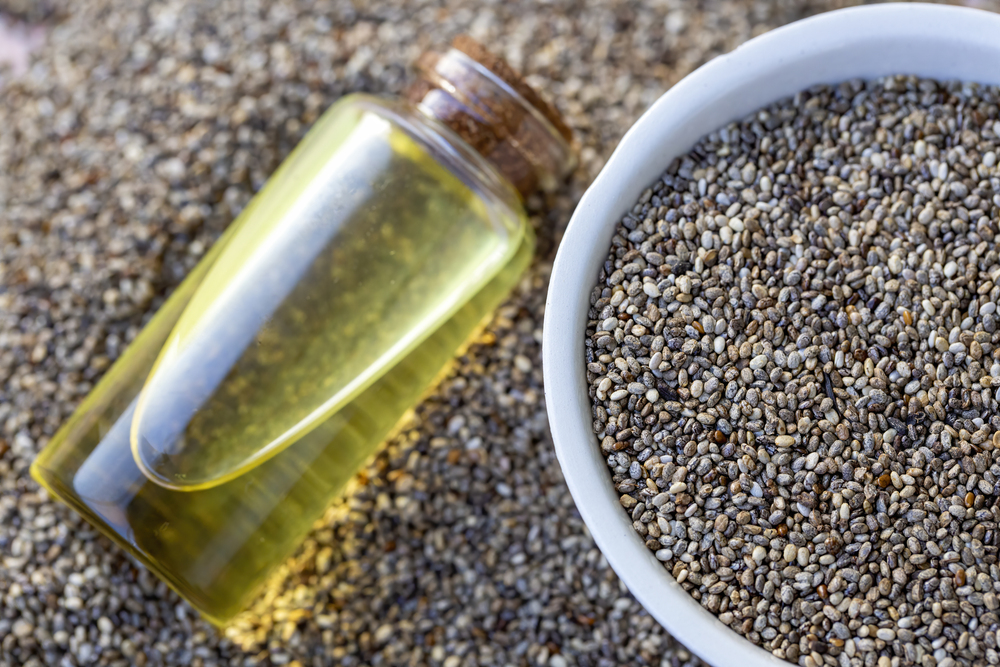 Bottle Chia Oil Bowl Seeds Table Space Text — Stock Photo, Image