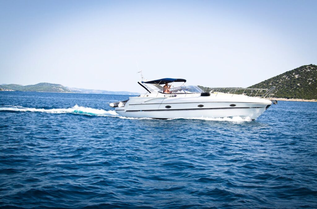 A man on his speedboat in a lake, A lot goes into choosing the best recreational boat, including where you plan to boat.