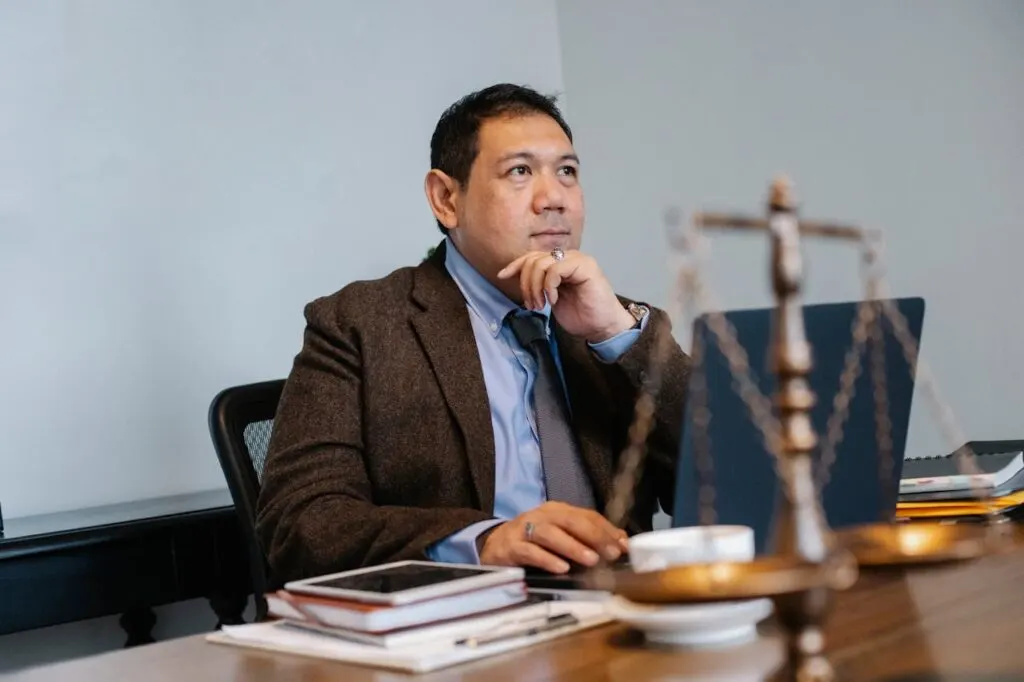 A lawyer sitting behind his desk