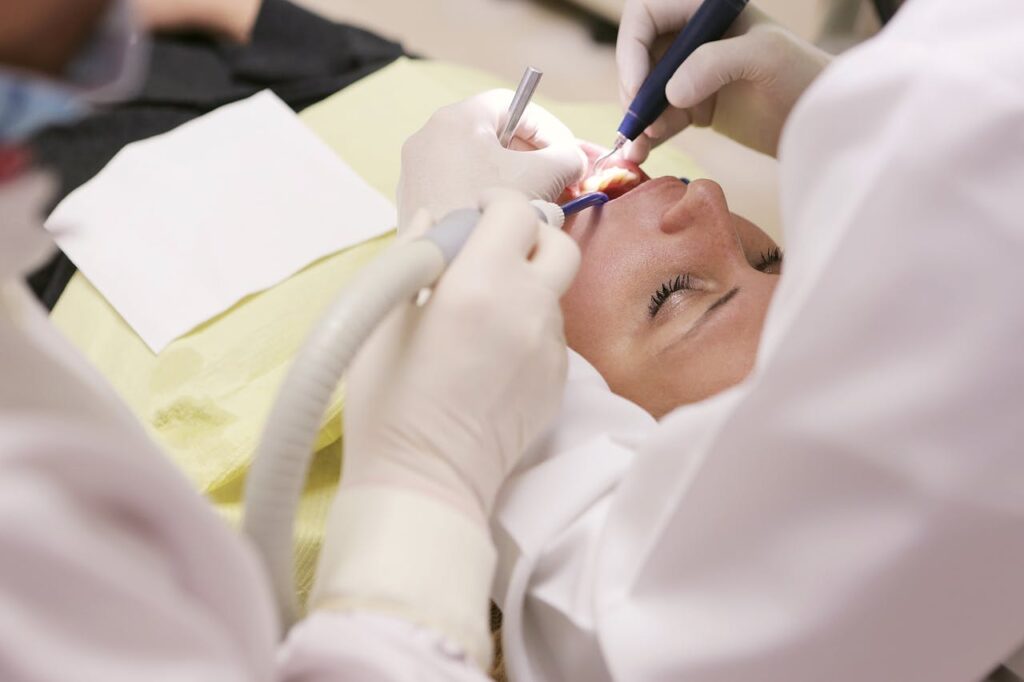 Woman undergoing dental work due to dental pain