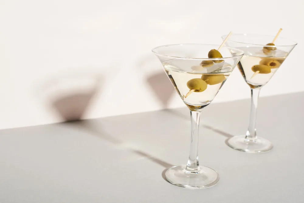 Martini cocktails with olives on white background — Photo